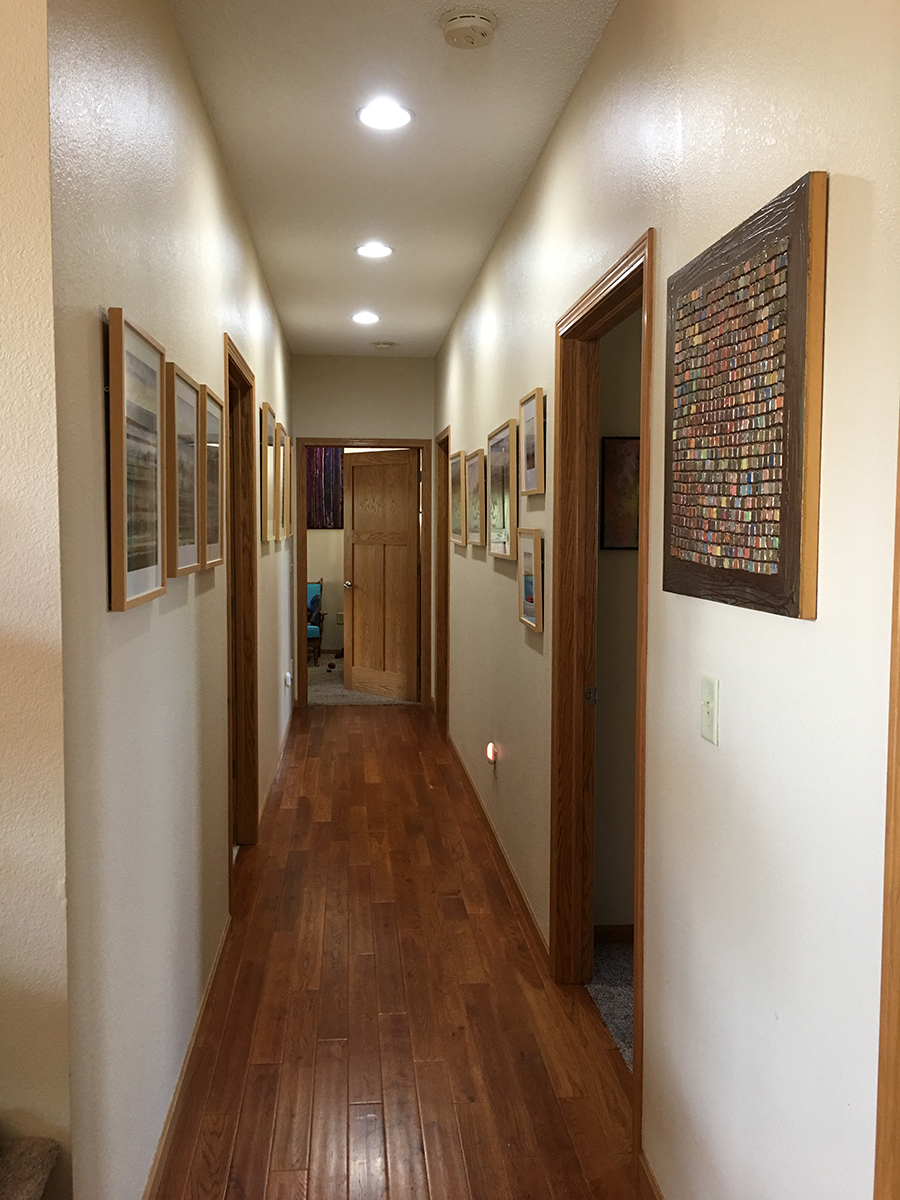 The Galley Gallery featuring framed watercolors (2015-present) and a mixed media painting circa 1995.